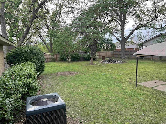 190 E Poplar St, Piggott, AR 72454 - view of yard featuring central AC and a fenced backyard