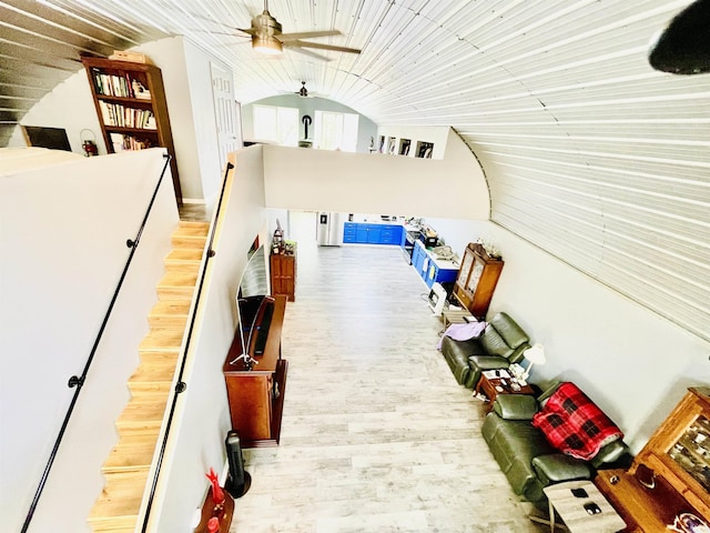 interior space with lofted ceiling and wood finished floors