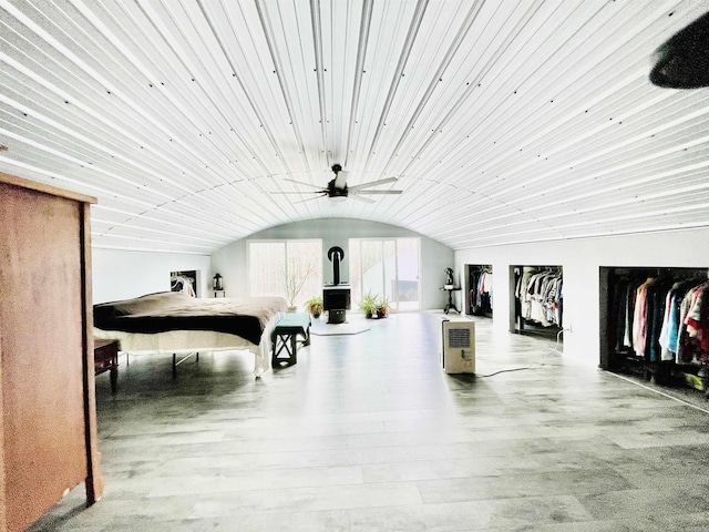 misc room with a ceiling fan, vaulted ceiling, and wood ceiling