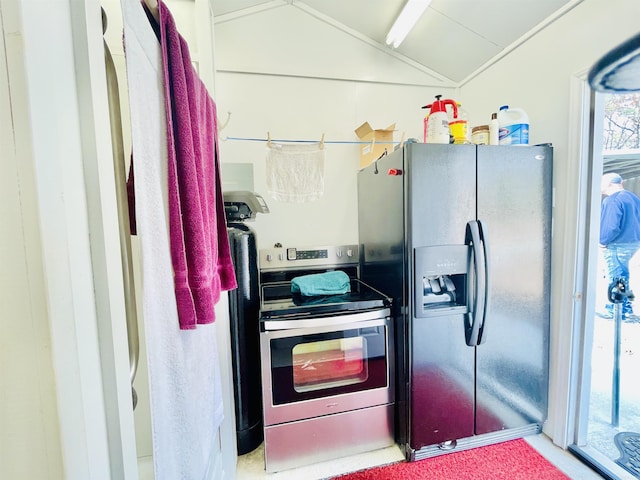 kitchen with stainless steel electric range oven, refrigerator with ice dispenser, and vaulted ceiling