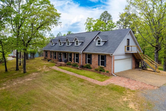 cape cod home with stairs, decorative driveway, covered porch, a front yard, and brick siding