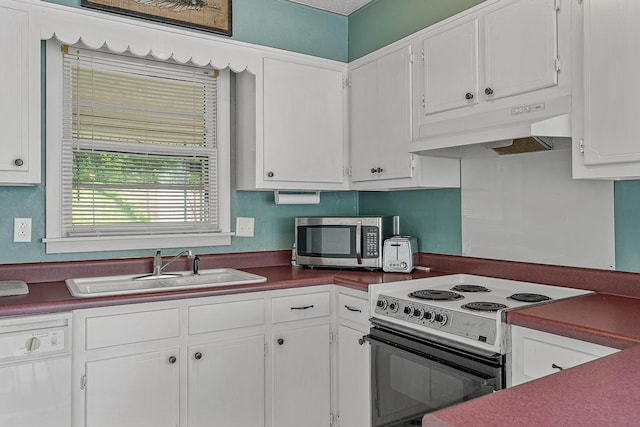 kitchen featuring stainless steel microwave, electric range, under cabinet range hood, white dishwasher, and a sink