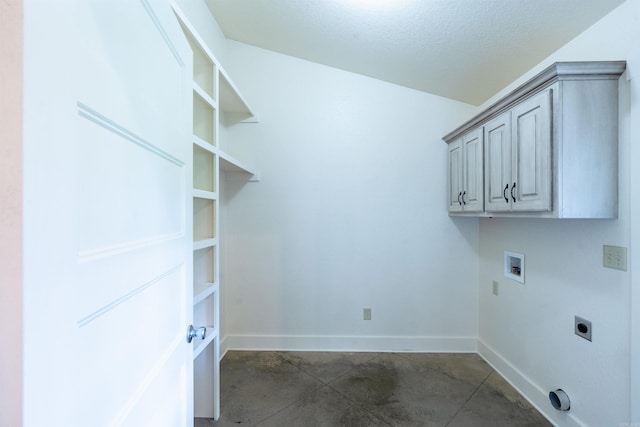 laundry room with hookup for an electric dryer, washer hookup, cabinet space, and baseboards