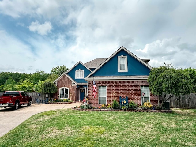 7 Samantha Cir, Searcy, AR 72143 - view of front of home with fence, concrete driveway, a front yard, and brick siding