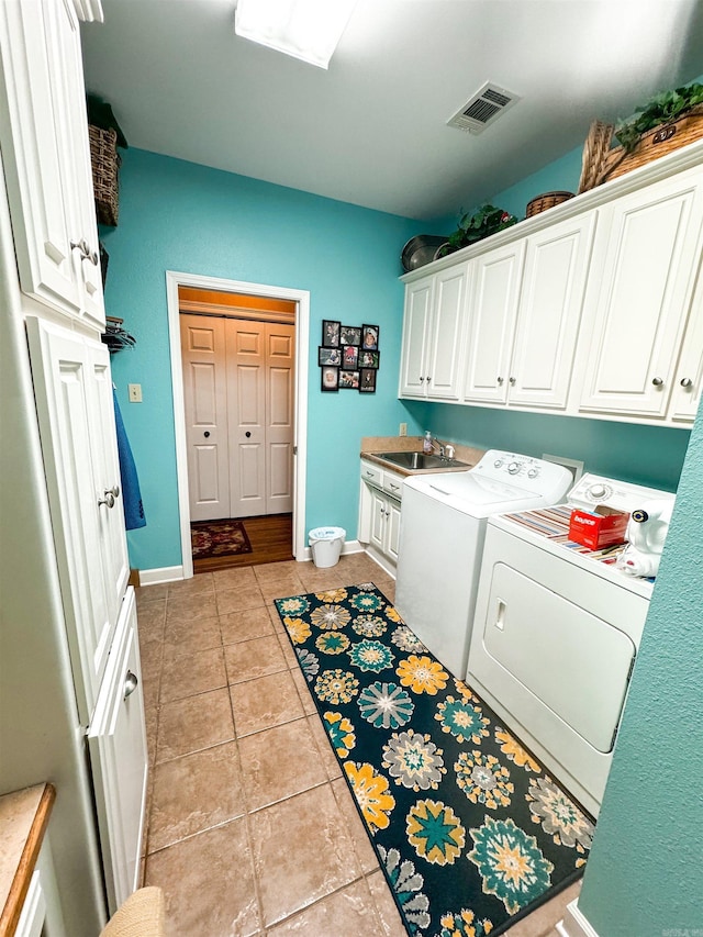 7 Samantha Cir, Searcy, AR 72143 - laundry room featuring separate washer and dryer, cabinet space, a sink, baseboards, and visible vents