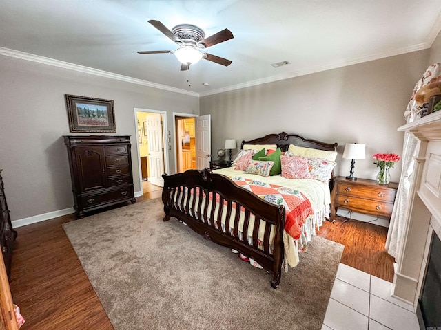 7 Samantha Cir, Searcy, AR 72143 - bedroom featuring crown molding, visible vents, baseboards, and a fireplace