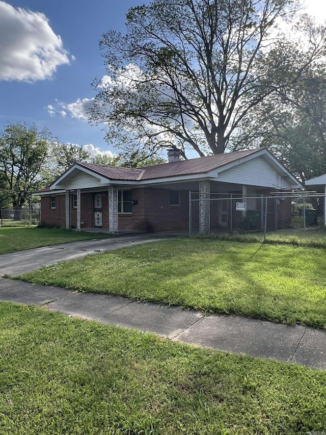904 Belmont Dr, Pine Bluff, AR 71601 - ranch-style home featuring brick siding, fence, and a front lawn