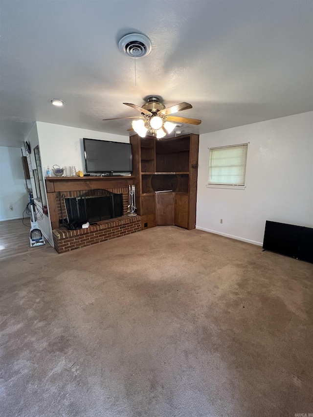 904 Belmont Dr, Pine Bluff, AR 71601 - unfurnished living room featuring carpet flooring, a fireplace, ceiling fan, visible vents, and baseboards