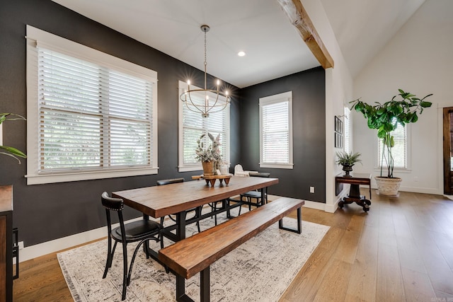 dining space with baseboards, light wood-type flooring, a notable chandelier, and recessed lighting