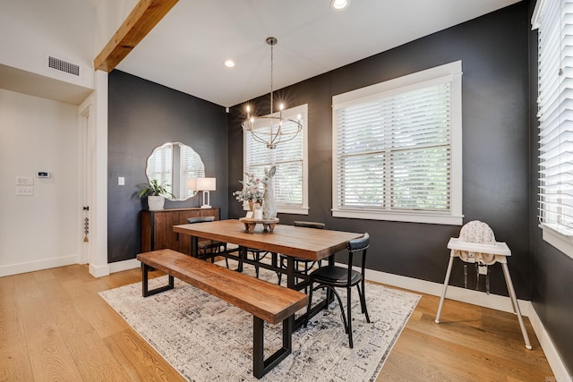 dining area with visible vents, baseboards, recessed lighting, light wood finished floors, and a notable chandelier