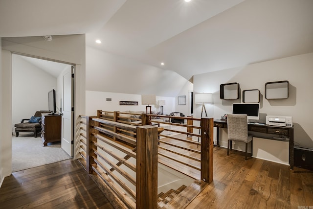 interior space featuring recessed lighting, wood finished floors, and vaulted ceiling