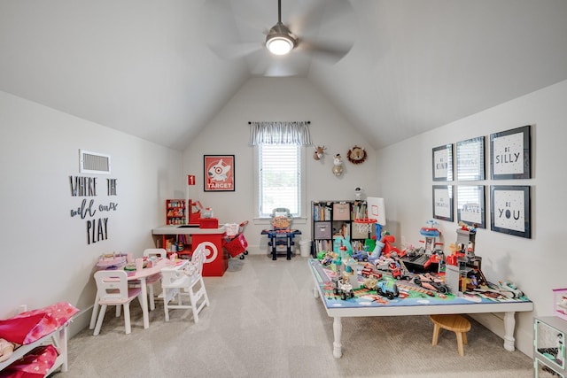 playroom with lofted ceiling, visible vents, baseboards, carpet floors, and a ceiling fan