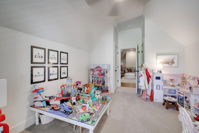playroom featuring lofted ceiling and carpet
