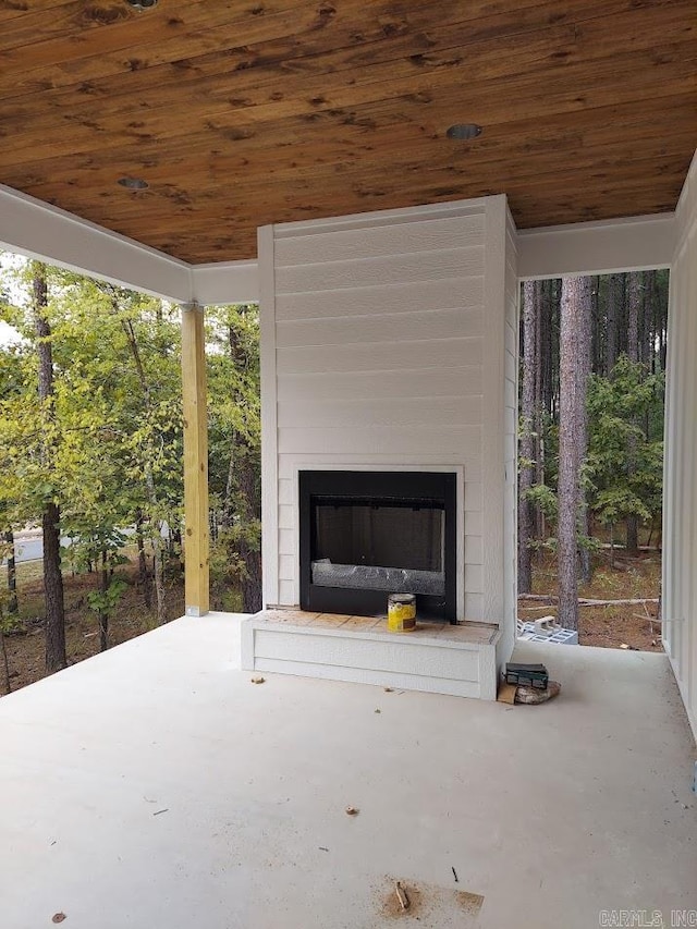 view of patio featuring exterior fireplace
