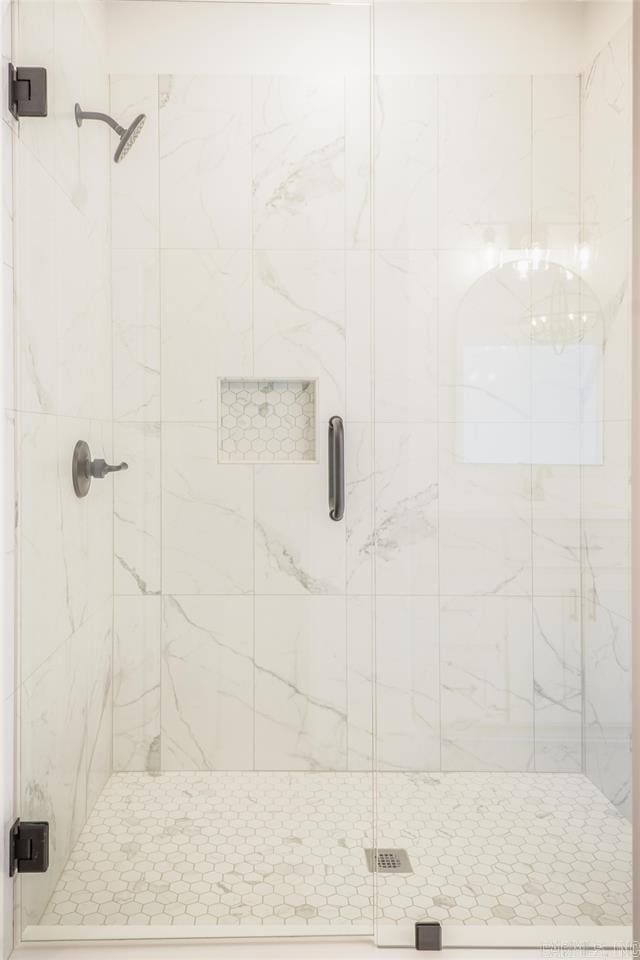 full bath featuring a shower stall