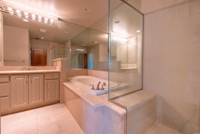 full bath featuring tile patterned floors, a shower stall, a bath, and vanity