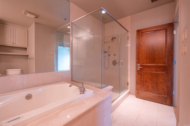 full bathroom with a garden tub, a stall shower, toilet, and visible vents