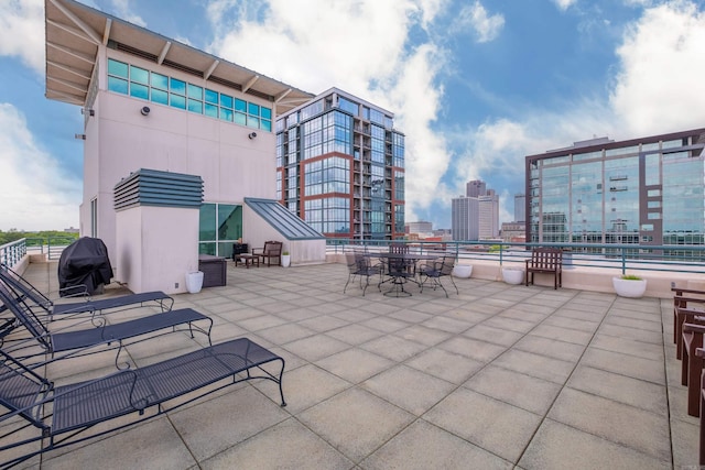 view of patio / terrace featuring a view of city and area for grilling