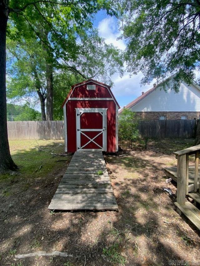 view of shed with a fenced backyard