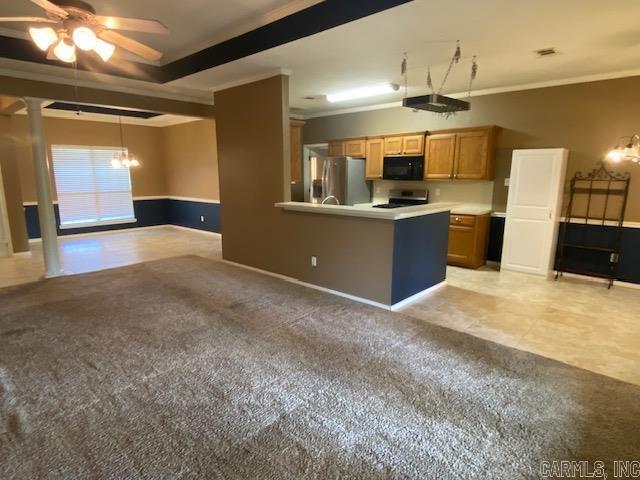 kitchen with stove, light colored carpet, stainless steel fridge with ice dispenser, ornamental molding, and black microwave