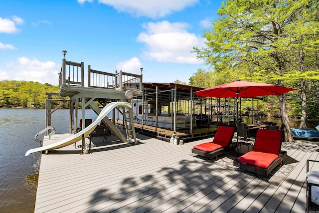 view of dock featuring boat lift and a water view