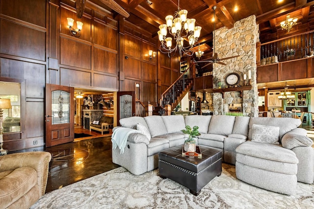 living area with wood ceiling, stairs, beam ceiling, a towering ceiling, and ceiling fan with notable chandelier
