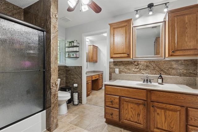 bathroom with vanity, visible vents, toilet, tile patterned floors, and a ceiling fan