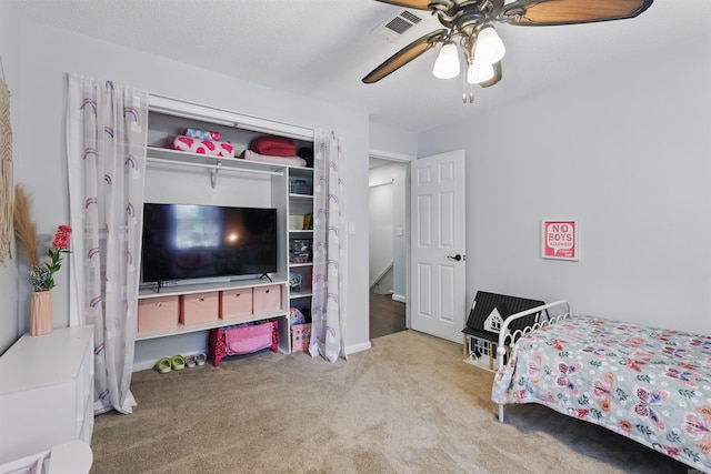 bedroom with a ceiling fan, carpet flooring, and visible vents