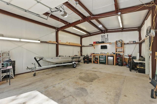garage featuring a workshop area and a garage door opener