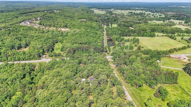 bird's eye view featuring a forest view