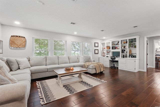 living area featuring recessed lighting, visible vents, and dark wood-style floors