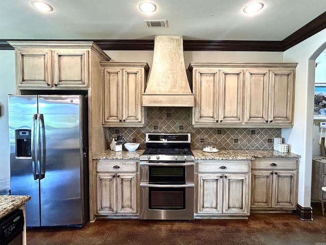kitchen featuring custom range hood, ornamental molding, appliances with stainless steel finishes, and visible vents