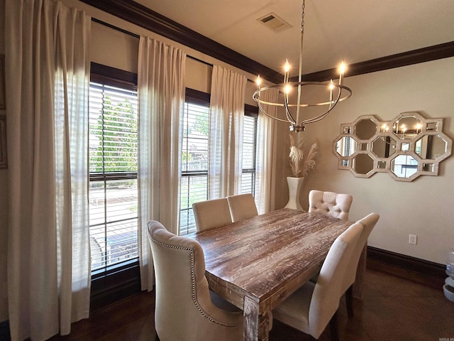 dining room with visible vents, ornamental molding, baseboards, and a notable chandelier