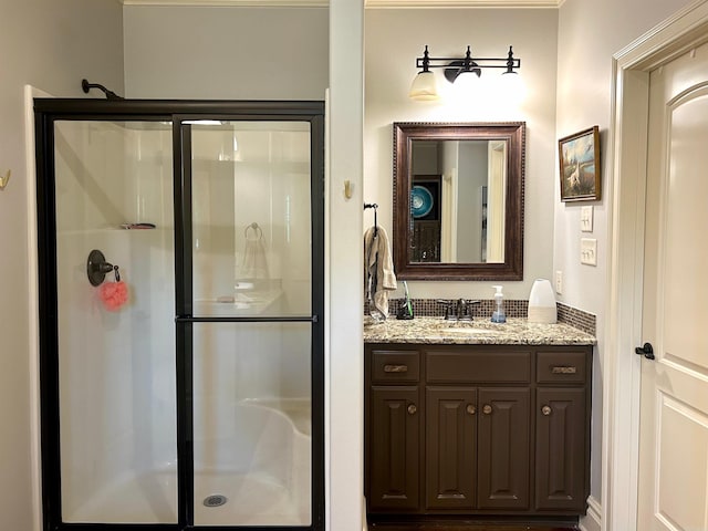 bathroom featuring vanity and a shower stall