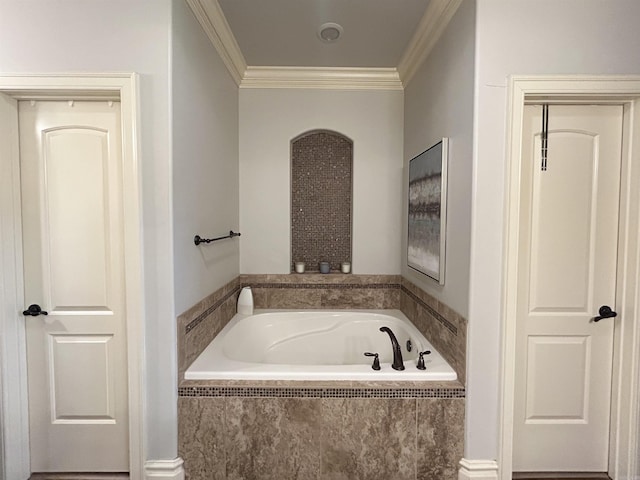 full bath featuring a garden tub and ornamental molding