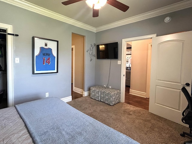carpeted bedroom featuring crown molding, a ceiling fan, and baseboards