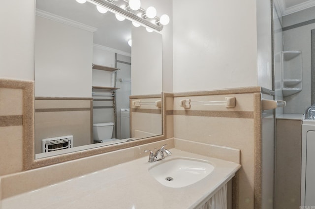 bathroom featuring ornamental molding, a wainscoted wall, toilet, and vanity