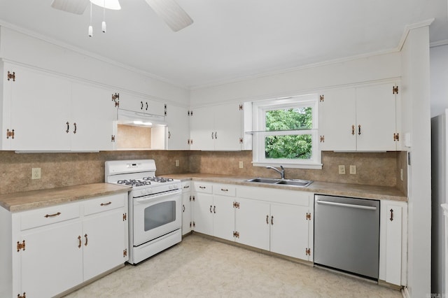 kitchen with gas range gas stove, tasteful backsplash, dishwasher, and a sink