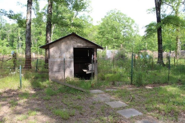 view of shed with fence