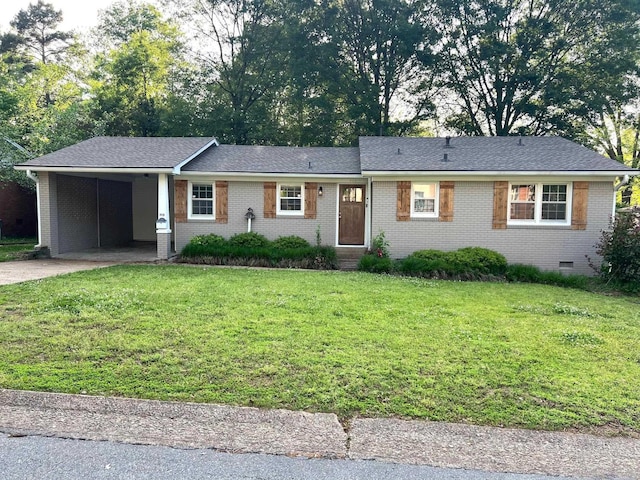 single story home featuring brick siding, a carport, a front lawn, and concrete driveway