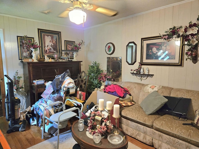 604 N Grand Ave, Mcrae, AR 72102 - living area featuring crown molding, ceiling fan, and wood finished floors