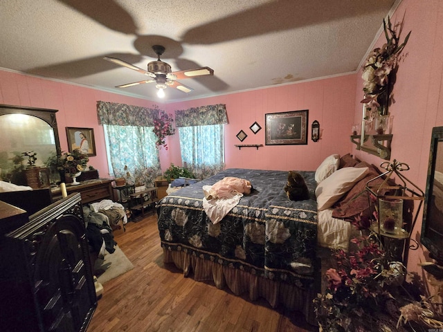 604 N Grand Ave, Mcrae, AR 72102 - bedroom featuring wood finished floors, a textured ceiling, and crown molding