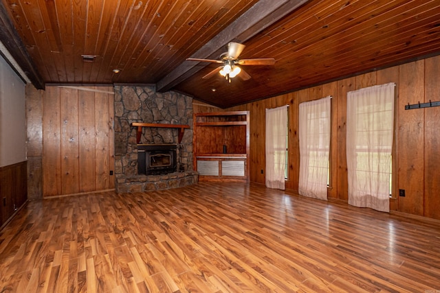 43 Calhoun 11, Hampton, AR 71744 - unfurnished living room featuring wooden ceiling, wood finished floors, lofted ceiling with beams, wood walls, and a ceiling fan