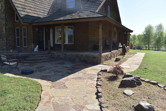 12192 Point Breeze Rd, Parks, AR 72950 - view of side of property featuring a lawn and a patio area