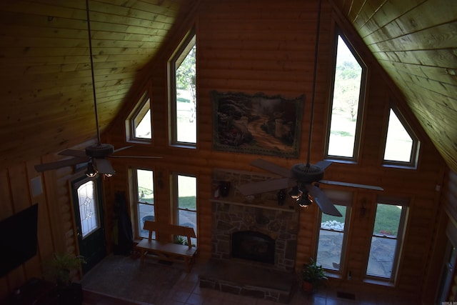 12192 Point Breeze Rd, Parks, AR 72950 - living area with wooden walls, ceiling fan, a wealth of natural light, and high vaulted ceiling