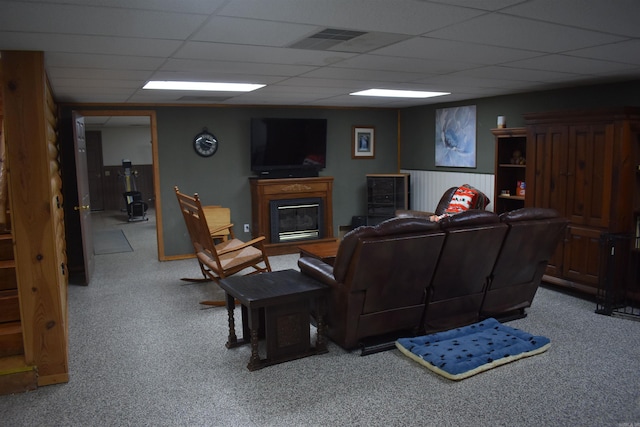 12192 Point Breeze Rd, Parks, AR 72950 - living room featuring carpet floors, a glass covered fireplace, a drop ceiling, and visible vents
