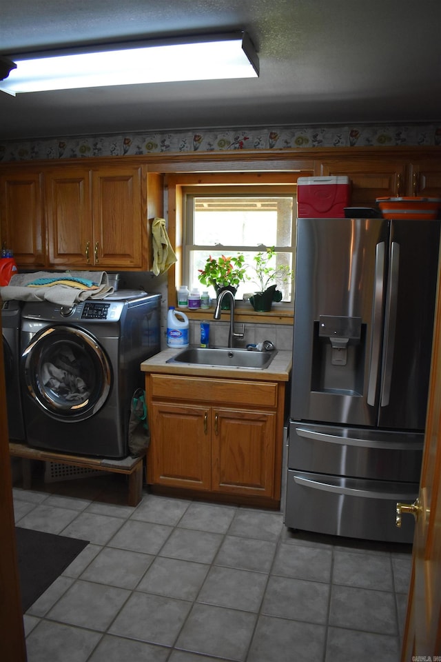 12192 Point Breeze Rd, Parks, AR 72950 - washroom with a sink, cabinet space, independent washer and dryer, and light tile patterned flooring