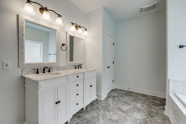 bathroom featuring double vanity, baseboards, visible vents, and a sink