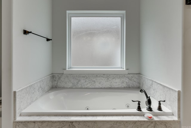 bathroom with a whirlpool tub