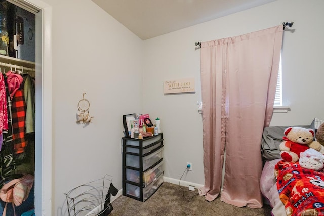 bedroom featuring baseboards, carpet, and lofted ceiling